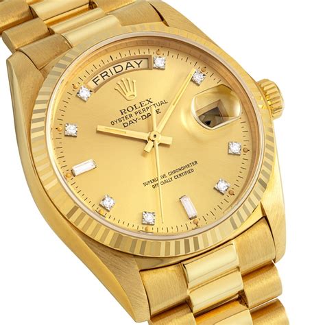 rolex day date gold.